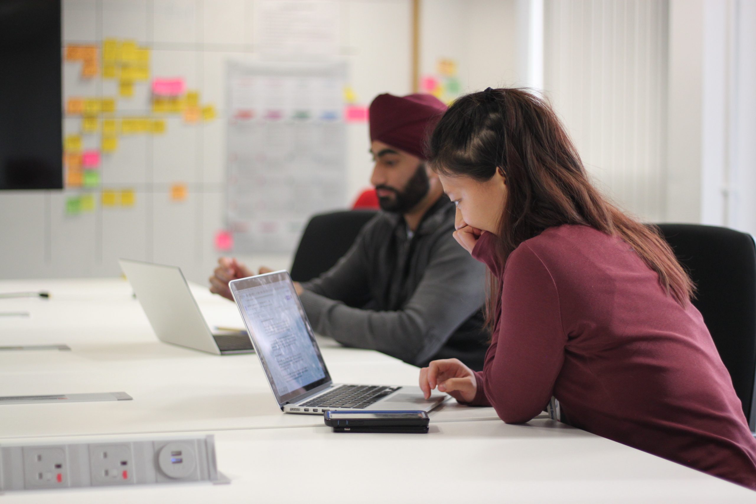 Apprentices at DIT, using laptops in the DIT office, London