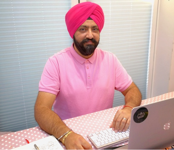 A picture of Baljit working from home at his laptop