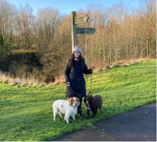 Kathy enjoying a walk with her dogs