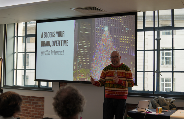 Matt Jukes stood in front of his blogs presentation on a big screen.