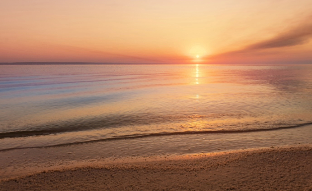 A sunset over a beach