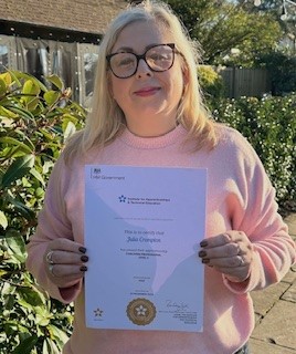 Julia Crompton holding a certificate