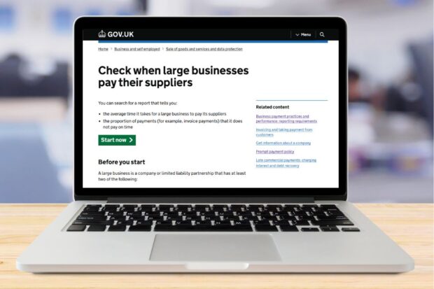 A laptop displaying a page advising users how to check when large businesses pay their suppliers