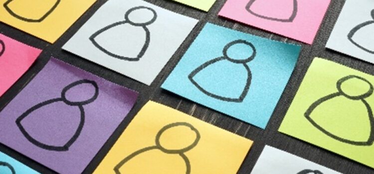 Coloured post it stickers with identical basic cartoon people drawn on them.