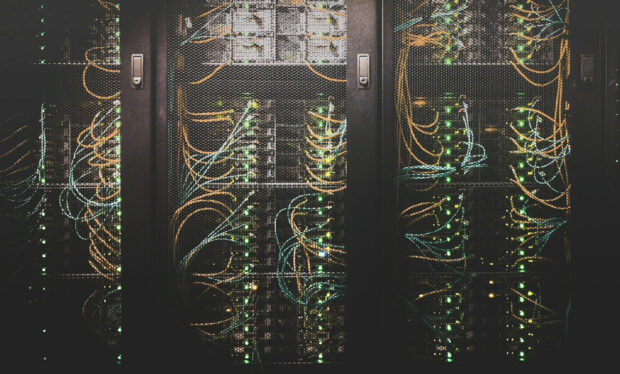 Inside data centre cabinets. Lots of wiring and little green lights.